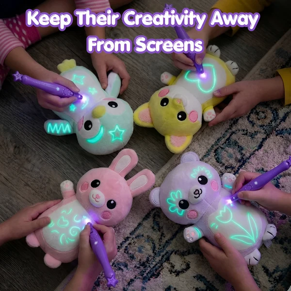 Four children drawing on their glow plush toys with the magic pen