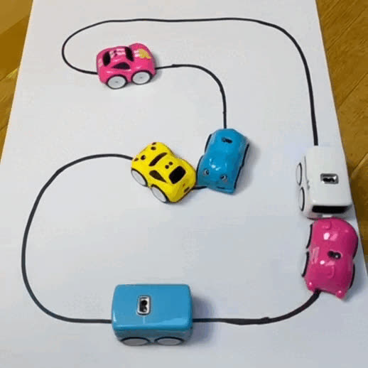 Magic Track Cars following a track drawn with a marker on paper